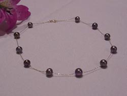 [ 7.0-7.8mm round black pearl tin cup necklace with 14kt gold chain and clasp. ]