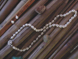 [ 16 in.oval white pearl necklace with matching earrings. ]